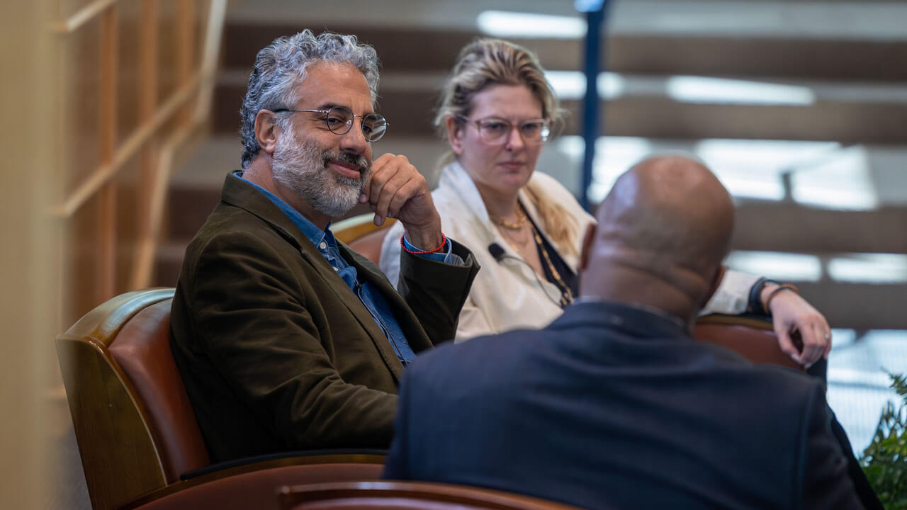 Omar Dajani and Mira Sucharov sit in chairs and talk.
